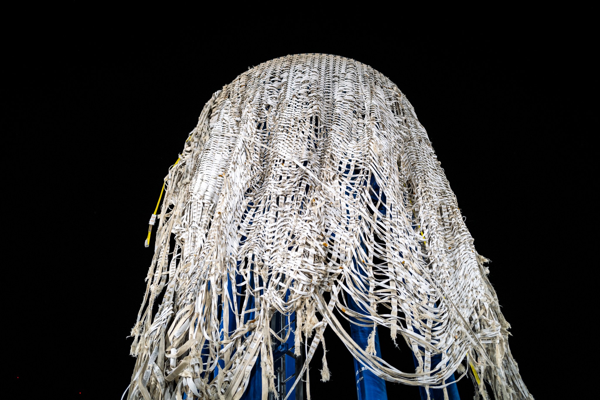 A photograph showing a close-up view of Sierra Space’s LIFE habitat, which is fabricated from high-strength webbings and fabric, after the pressurization to failure experienced during a burst test