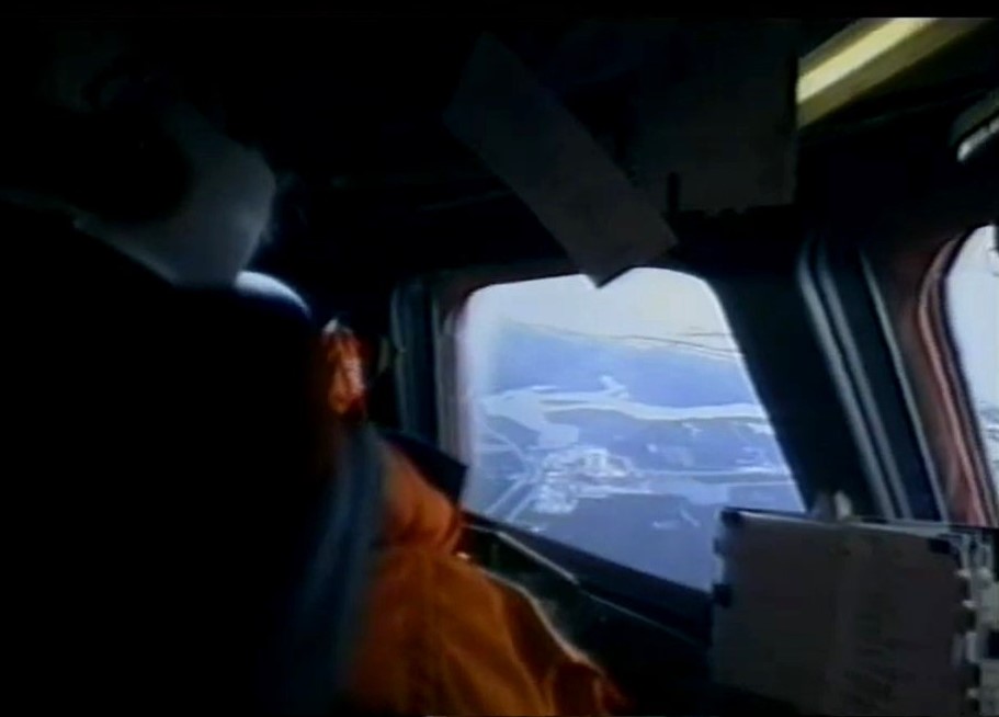 Robert D. Cabana pilots Columbia during the final approach to NASA's Kennedy Space Center (KSC) in Florida, with the Vehicle Assembly Building visible through the window
