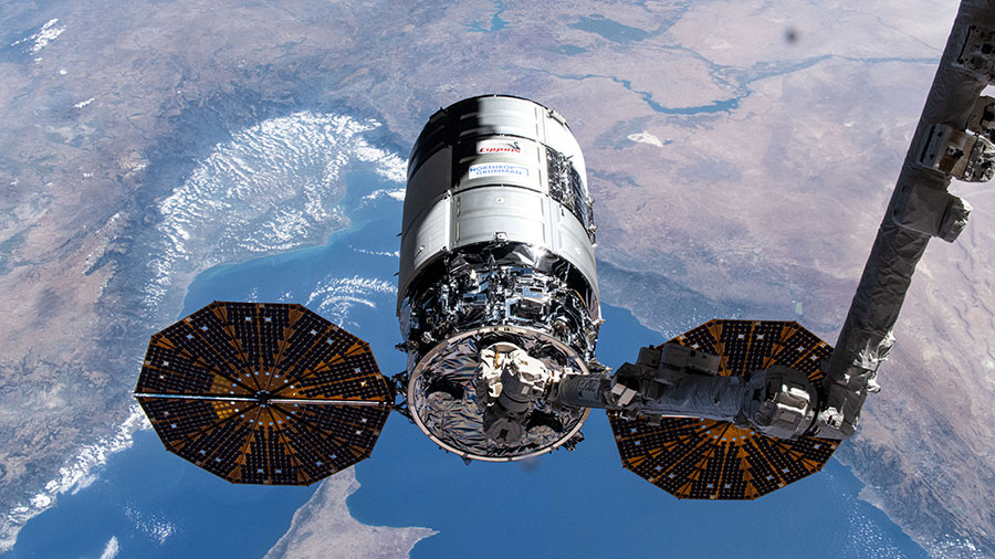 The Cygnus cargo craft is pictured in the grips of the Canadarm2 robotic arm as the International Space Station orbited 262 miles above the Mediterranean Sea.