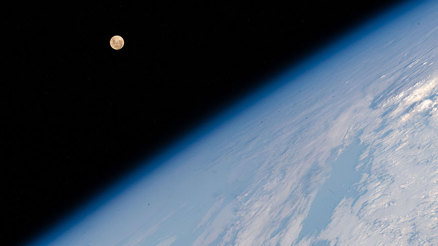 The Full Moon pictured above Earth's horizon as the space station soared above the Indian Ocean south of the African island nation of Madagascar.