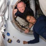 NASA's Boeing Crew Flight Test astronauts (from top) Butch Wilmore and Suni Williams pose on June 13, 2024 for a portrait inside the vestibule between the forward port on the International Space Station's Harmony module and Boeing's Starliner spacecraft.