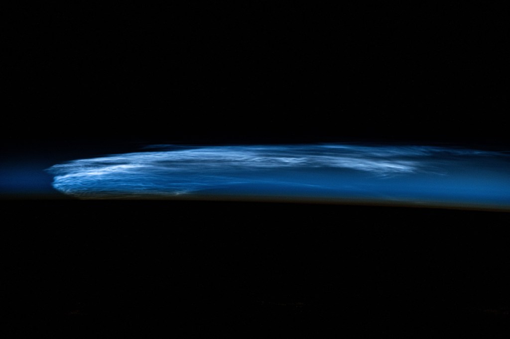 Noctilucent clouds, high altitude clouds only visible when the Sun is below the Earth's horizon and illuminating them, are pictured from the International Space Station as it orbited 258 miles above eastern Turkey.