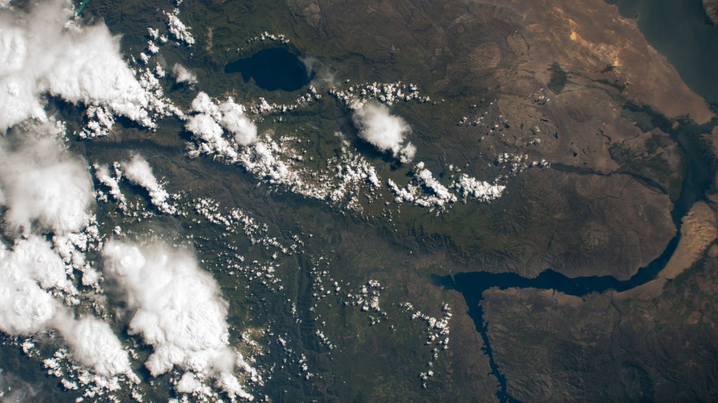 At top left, is Lake Markakol, and at lower right, is the Irtysh River flowing into Lake Zayson in this photograph from the International Space Station as it orbited 259 miles above Kazakhstan.