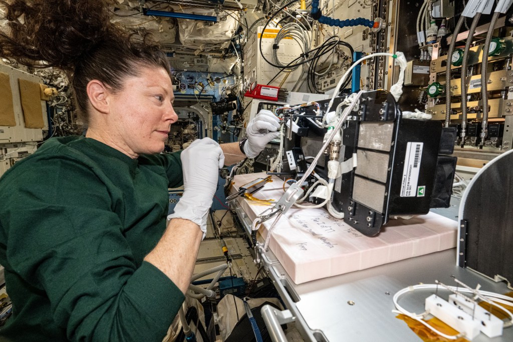 NASA astronaut and Expedition 71 Flight Engineer Tracy C. Dyson services research components inside the Solid Combustion Experiment Module (SCEM) aboard in the Interational Space Station's Kibo laboratory module. The SCEM enables combustion research in microgravity to study how materials burn in weightlessness and improve fire safety techniques aboard spacecraft.