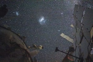 The Large Magellanic Cloud (center) and the Small Magellanic Cloud (upper left), dwarf galaxies in close proximity with the Milky Way galaxy, are pictured from the International Space Station. NASA astronaut and Expedition 71 Flight Engineer Matthew Dominick took this long-duration photograph with a station camera increasing its sensitivity to account for low light conditions.