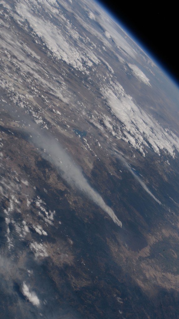 Wildfires in northern California are pictured from the International Space Station as it orbited 261 miles above the Pacific Ocean off the coast of Washington's Olympic National Forest.