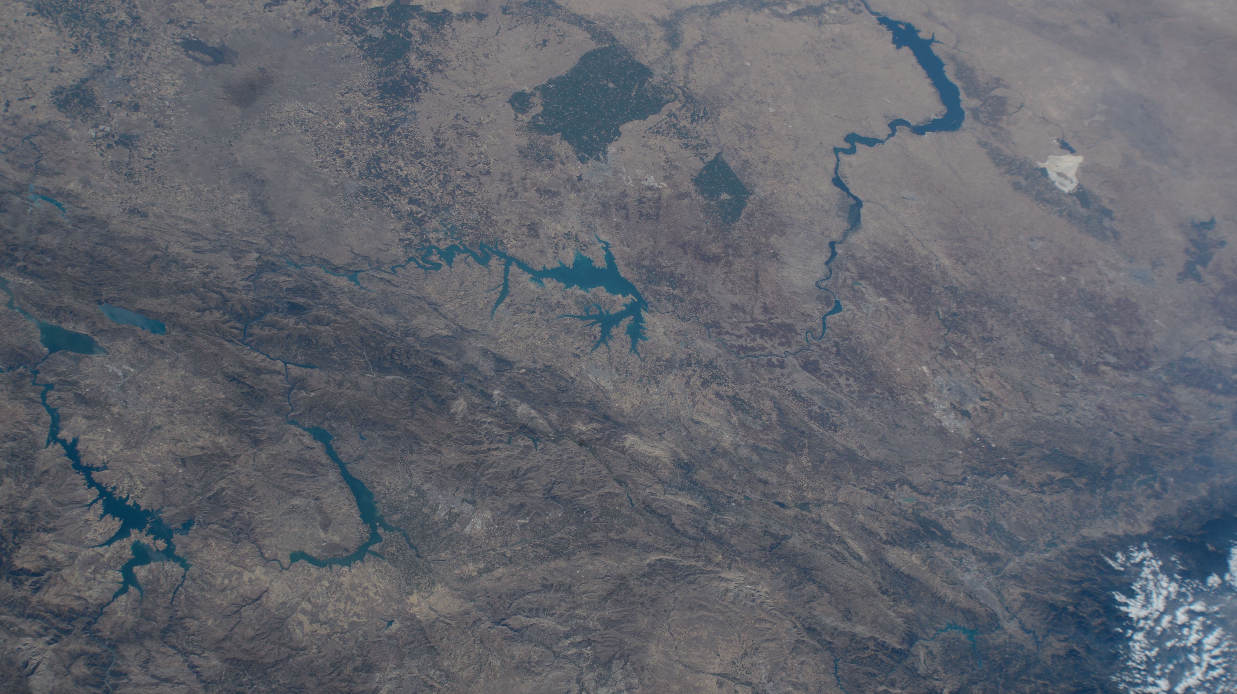 Lake Assad in Syria (upper right) and lakes created by hydroelectric dams in Turkiye, all along the Euphrates River, are pictured from the International Space Station as it orbited 263 miles above the Turkish nation that connects Europe with Asia.