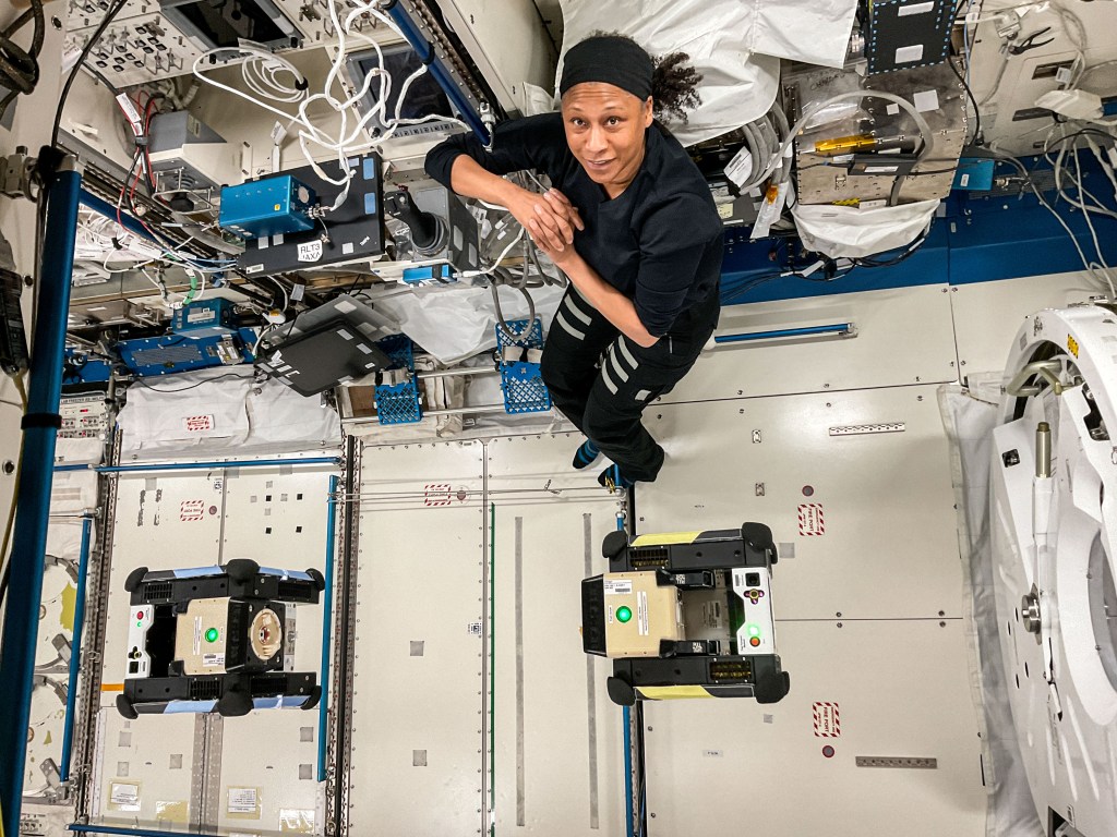 NASA astronaut and Expedition 71 Flight Engineer Jeanette Epps monitors a pair of Astrobee robotic free-flying assistants as they demonstrate autonomous docking maneuvers inside the International Space Station's Kibo laboratory module. The cube-shaped, toaster-sized devices were operating with a connecting interface system, called CLINGERS with an embedded navigation sensor, that may benefit construction in space.