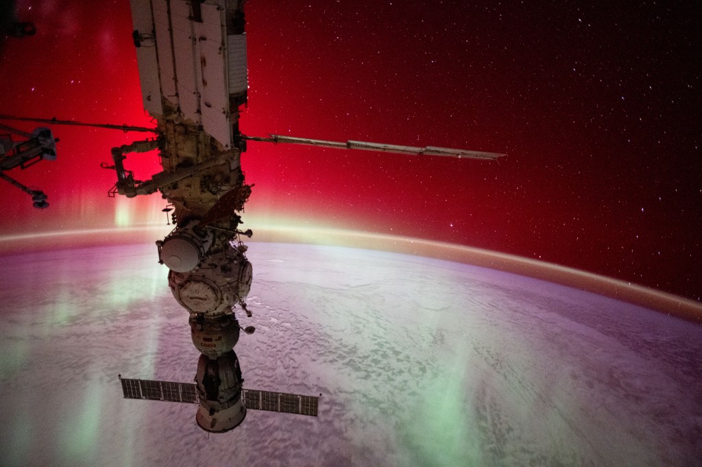 An aurora radiates brightly above the Indian Ocean in this photograph from the International Space Station as it soared 270 miles above the Earth's surface and about 1,280 miles southwest of Perth, Australia. In the foreground, is the Soyuz MS-25 crew ship docked to the Prichal docking module which is itself attached to the Nauka science module. The European robotic arm is also connected to Nauka.