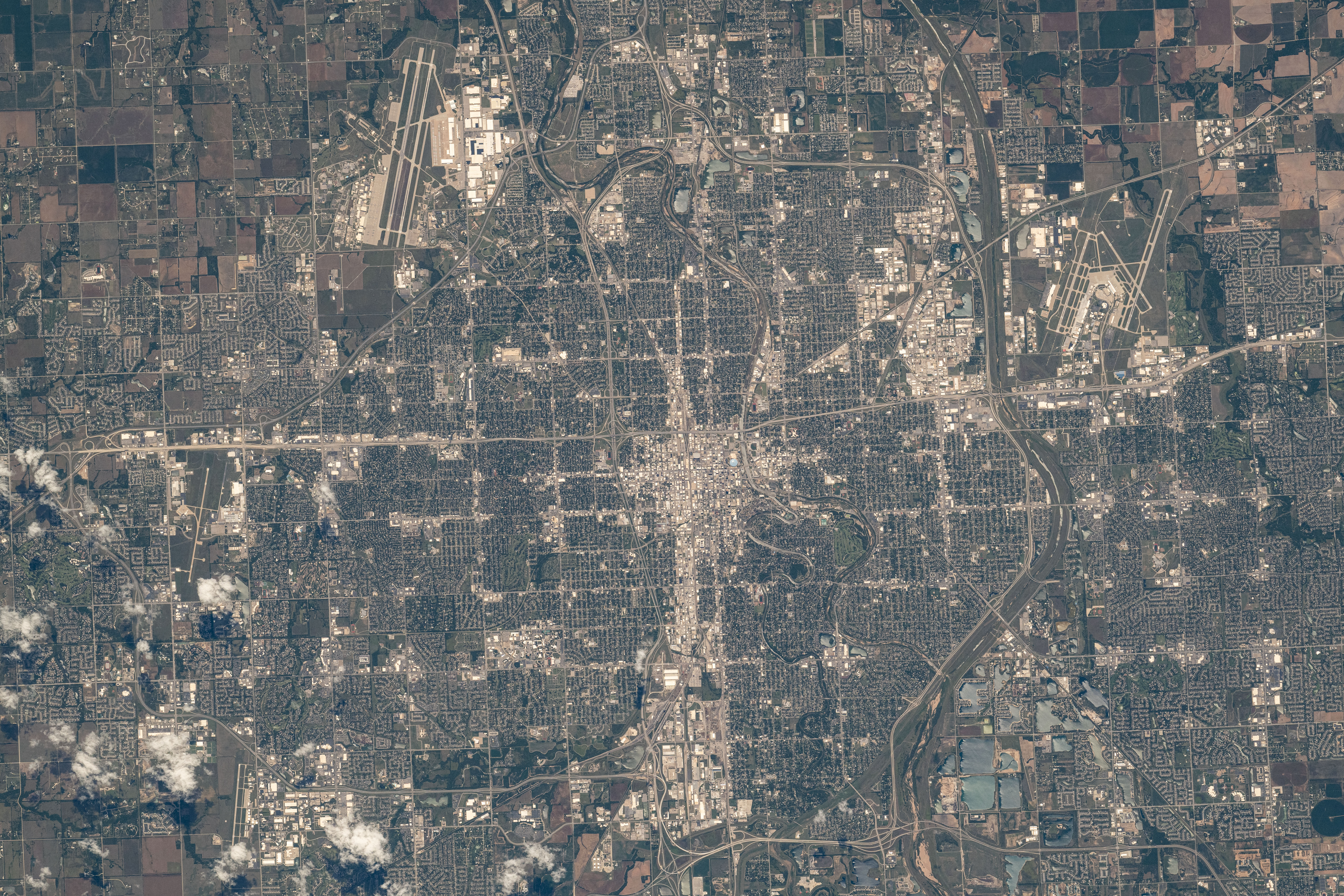 Wichita, Kansas, a city with a population of nearly 400,000, with McConnell Air Force Base just outside the city limits (top left) and hosting the Dwight D. Eisenhower National Airport (upper right), is photographed from the International Space Station as it orbited 260 miles above.