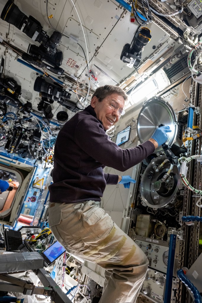 NASA astronaut and Expedition 71 Flight Engineer Mike Barratt swaps sample cartridges inside the Materials Science Laboratory (MSL), a research furnace facilitating discoveries of new and improved materials as well as new uses for existing materials such as metals, alloys, polymers, and more. The MSL is located inside the International Space Station's Destiny laboratory module.