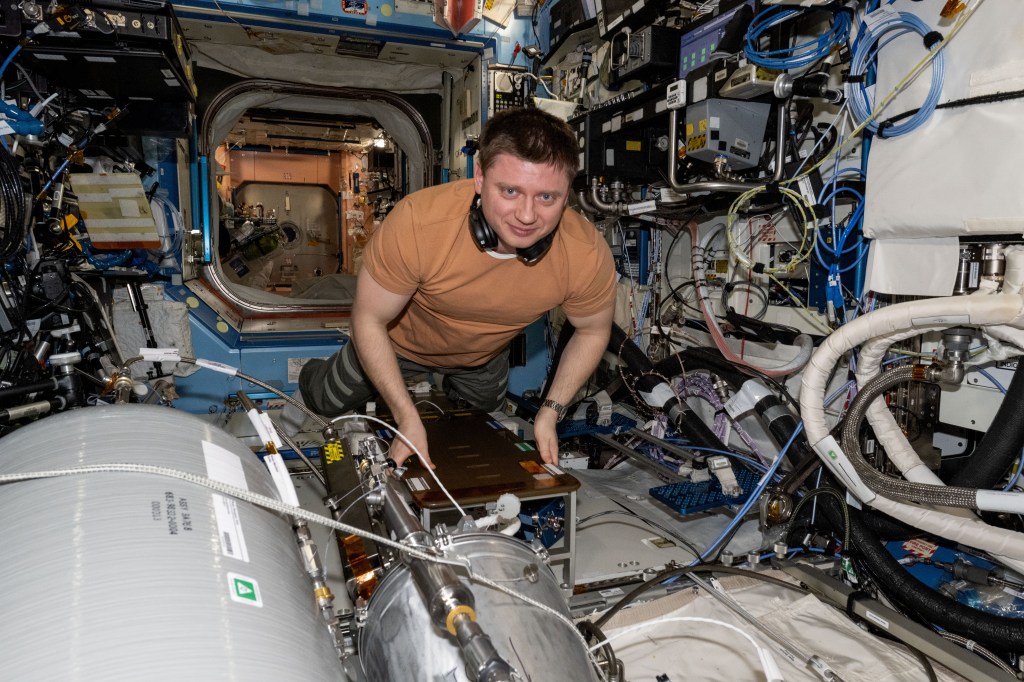 Roscosmos cosmonaut and Expedition 71 Flight Engineer Alexander Grebenkin works on transferring water from resupply tanks to life support systems aboard the International Space Station's Destiny laboratory module.
