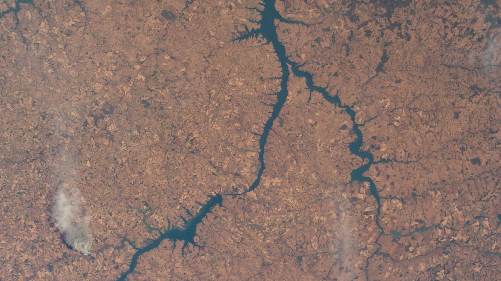Brazil's Single Island Dam (top) leads into the Paranaiba River which splits into the Rio Grande that leads into the Red Water Dam. The International Space Station was orbiting 260 miles above the South American nation at the time of this photograph.