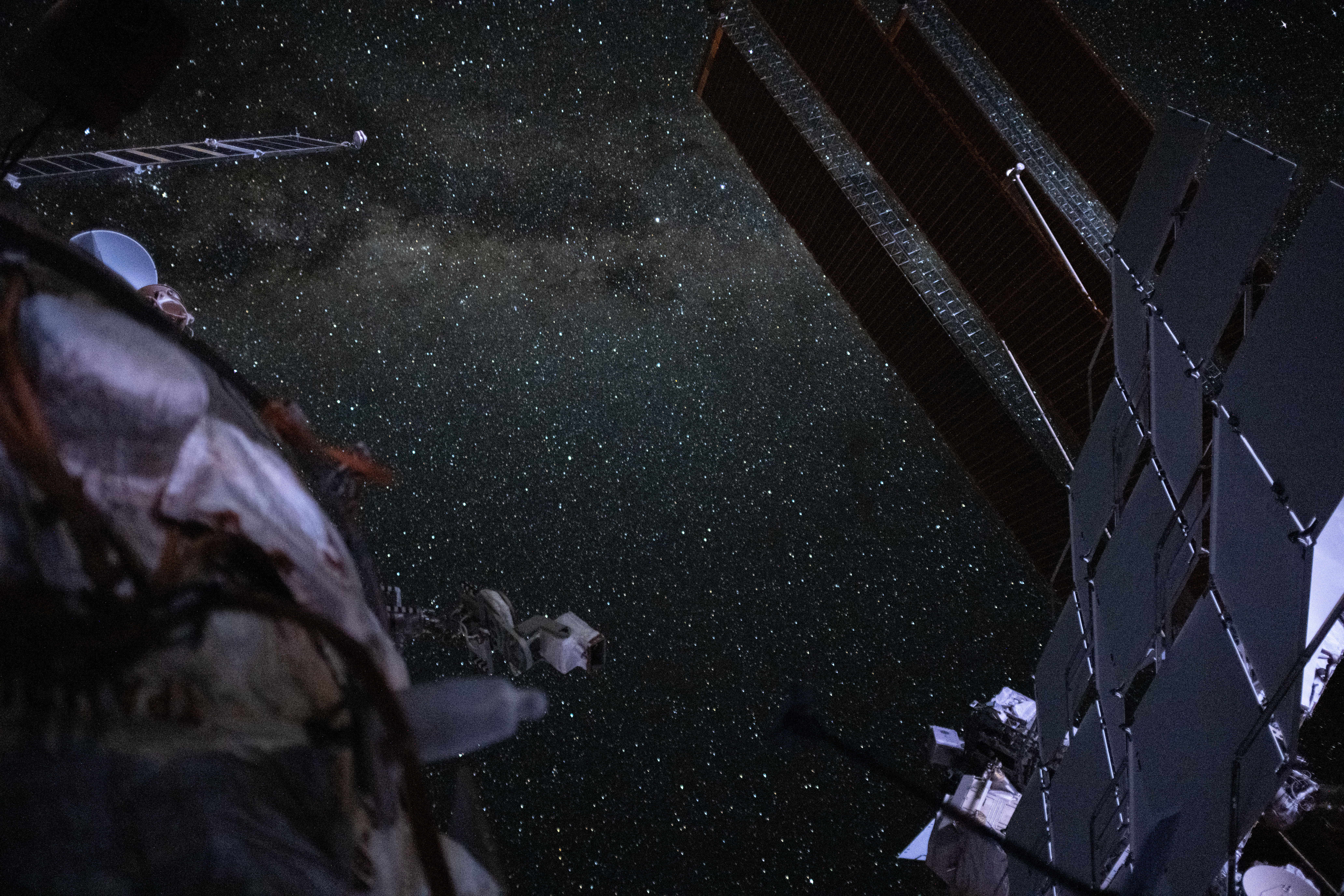 The Milky Way is pictured from the International Space Station near the top of this long-duration photograph with a camera programmed for high sensitivity.