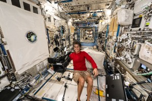 NASA astronaut and Boeing's Crew Flight Test Pilot Suni Williams smiles for a portrait in the middle of maintenance work aboard the International Space Station's Kibo laboratory module.