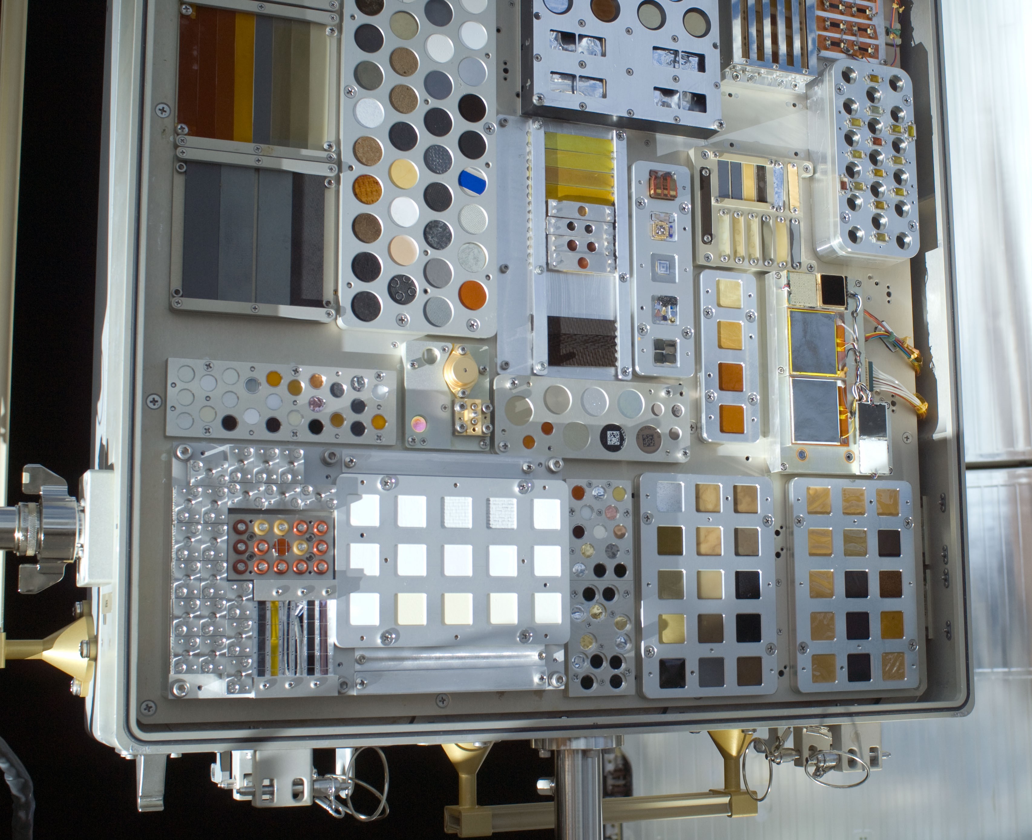 An open MISSE container showing the various exposure samples