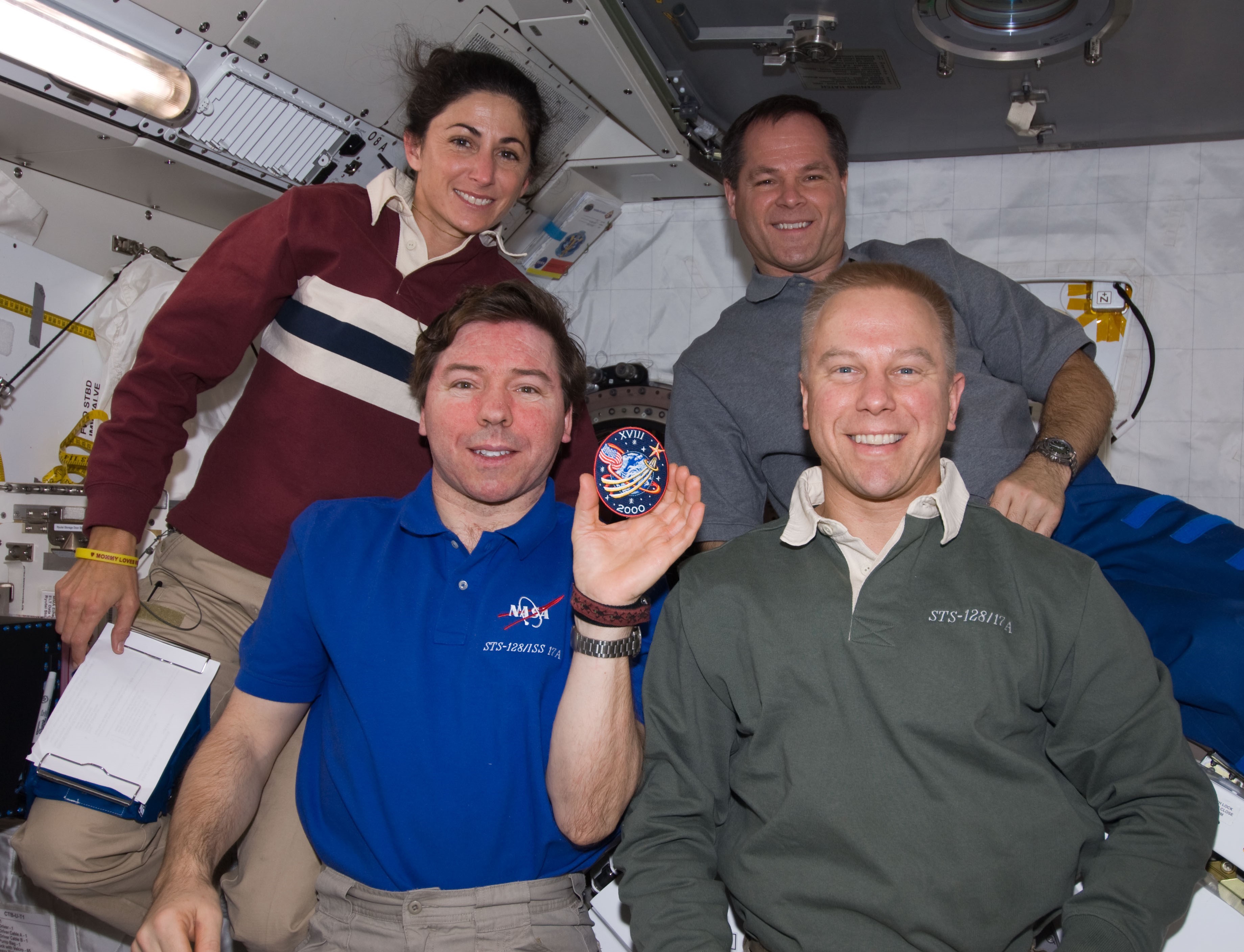 Four members of the astronaut class of 2000 in space together