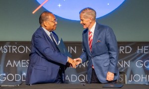 NAACP Board Chair Leon Russell, left, and NASA Administrator Bill Nelson, right, shake hands after signing a Space Act Agreement between NASA and the NAACP during a 5th Annual Hidden Figures Street Naming Anniversary event Thursday, Sept. 19, 2024, at the Mary W. Jackson NASA Headquarters building in Washington.
