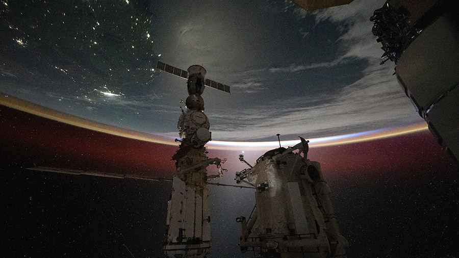 The last rays of an orbital sunset illuminate Earth's atmosphere as the space station 267 miles above off the coast of Australia.