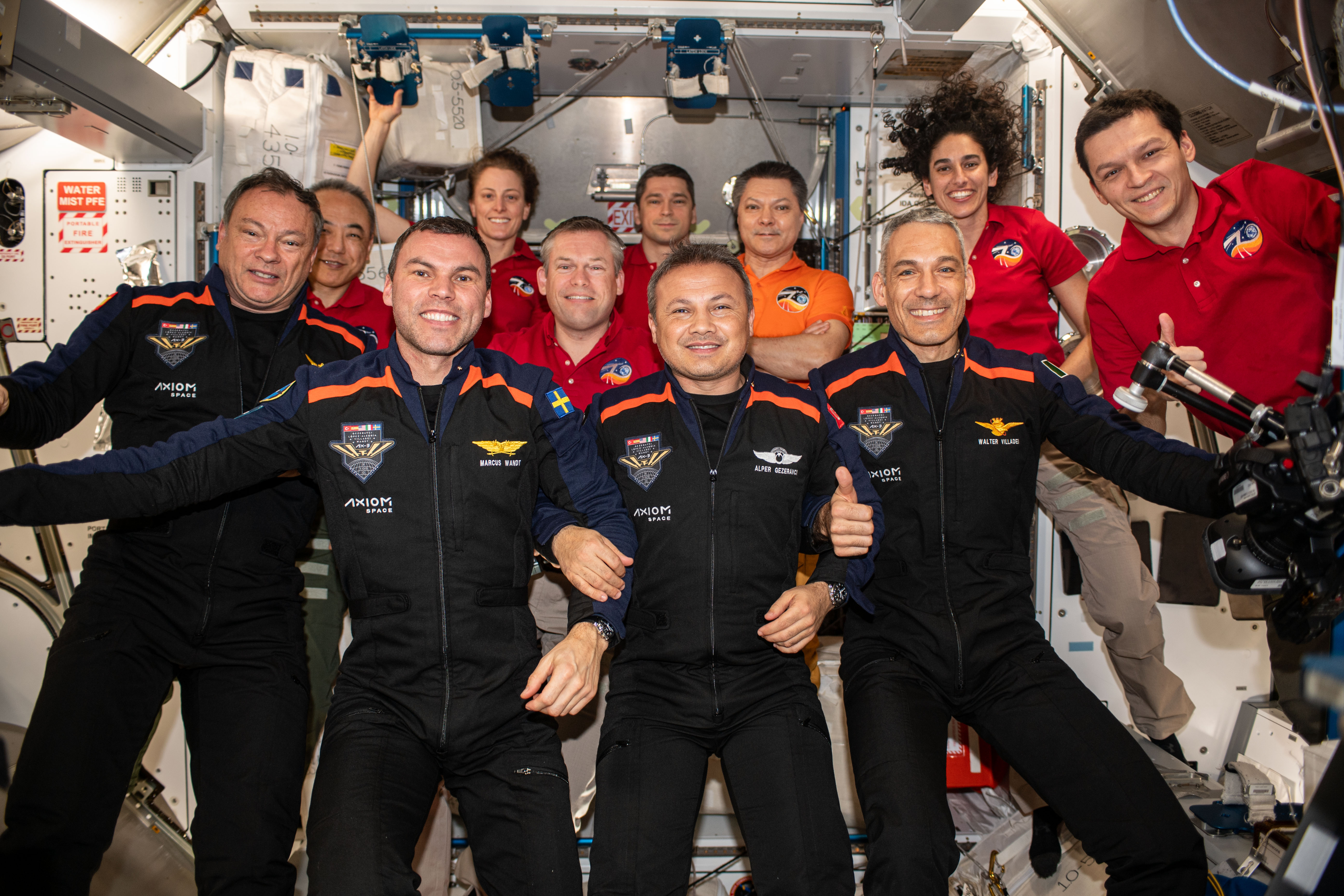 The 11 members of the Expedition 70 and Ax-3 crews, with Lopez-Alegria at far left