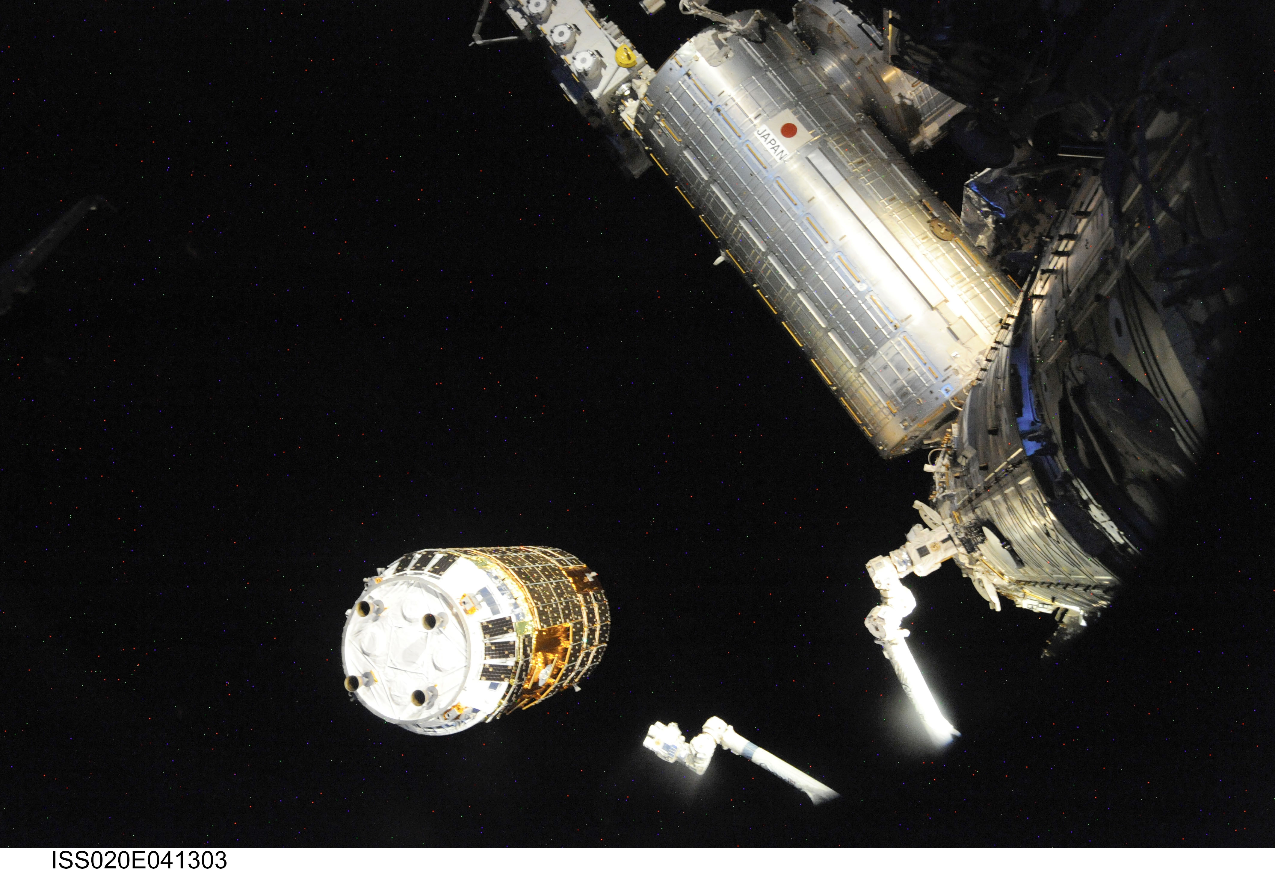 The Canadarm2 robotic arm reaches out to grapple the Japanese H-II Transfer Vehicle (HTV) before installing the HTV to the Harmony module's Earth-f...