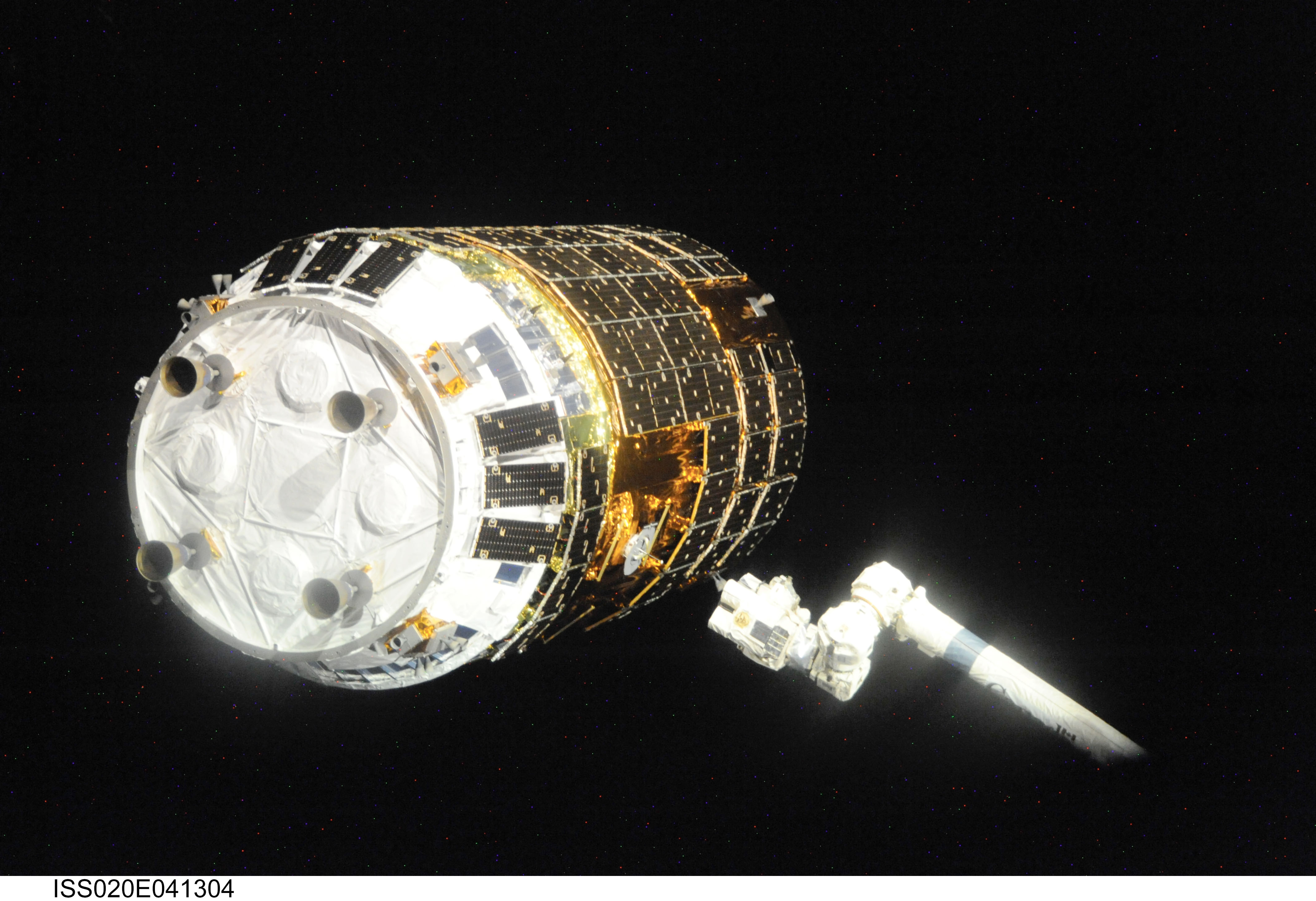 Backdropped by the blackness of space, the International Space Station's Canadarm2 prepares to grapple the unpiloted Japanese H-II Transfer Vehicle...