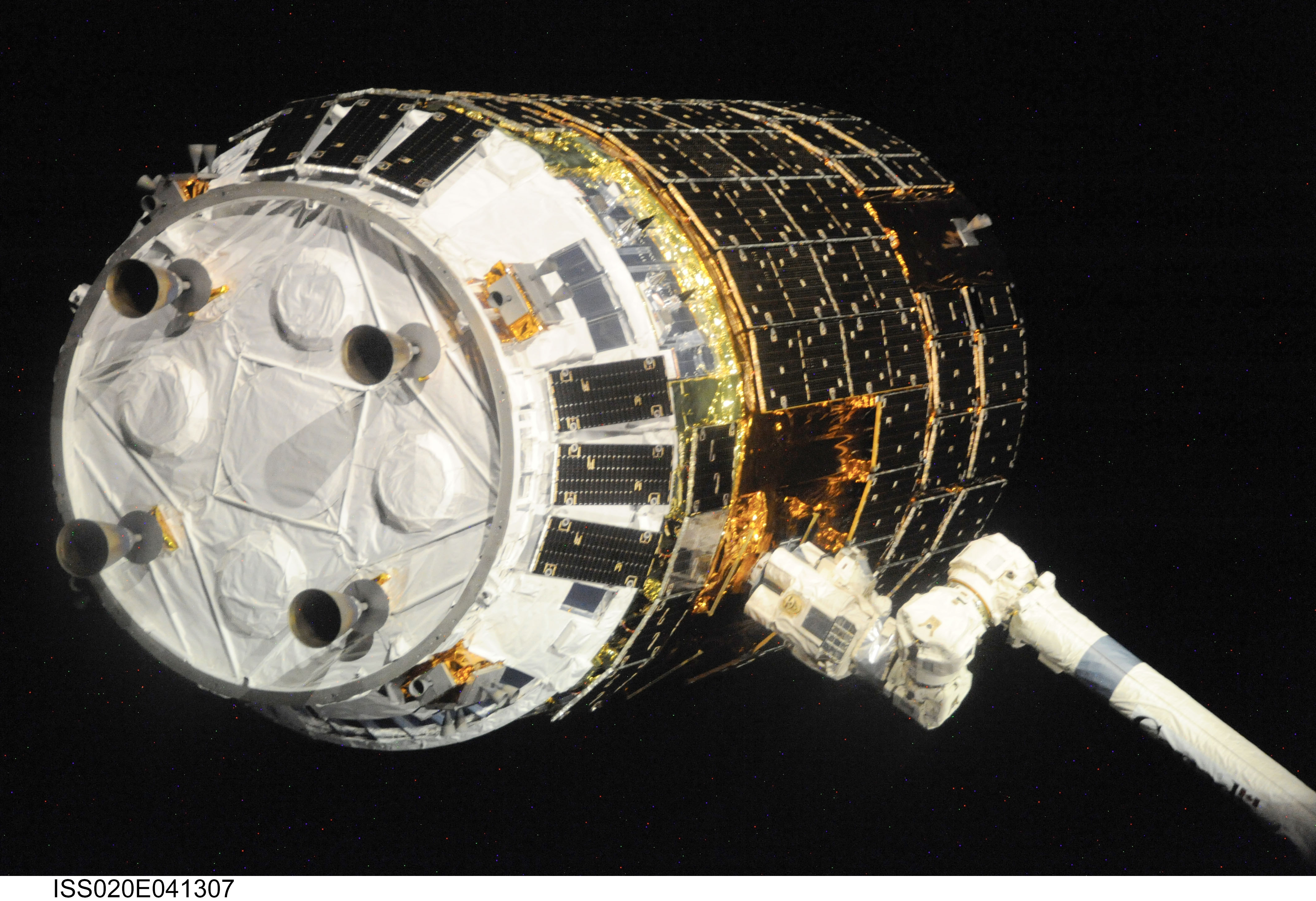 Backdropped by the blackness of space, the International Space Station's Canadarm2 grapples the unpiloted Japanese H-II Transfer Vehicle (HTV) as i...