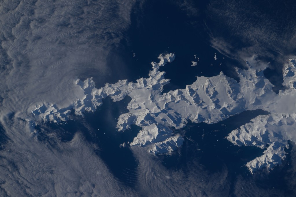 iss071e581850 (Sept. 1, 2024) -- In the southern Atlantic ocean is a snow-covered South Georgia Island. The British Overseas Territory was photographed by NASA astronaut Michael Barratt as the International Space Station orbited 267 miles above.