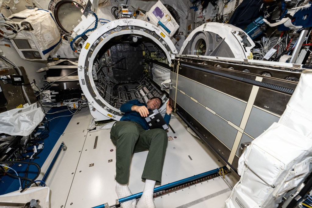 NASA astronaut and Expedition 71 Flight Engineer Mike Barratt removes the multipurpose experiment platform (MPEP) from the Kibo laboratory module's airlock. The MPEP was attached to the Japanese robotic arm and carried a small satellite orbital deployer into the vacuum of space pointed away from the International Space Station. Afterward, a series of CubeSats were released into Earth orbit from the deployer for educational and research purposes.