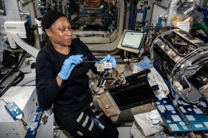 NASA astronaut and Expedition 71 Flight Engineer Jeanette Epps replaces and cleans research components inside the Destiny laboratory module's Combustion Integrated Rack for a series of fire safety investigations. The experiments explore how flames spread, how materials burn, and ways to extinguish fires in microgravity to improve safety in space.