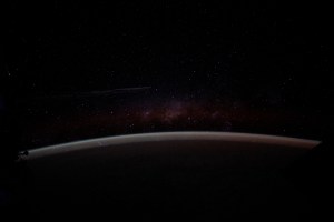 The Earth's airglow blankets the atmosphere with a wispy Milky Way in the background above the horizon in this long-duration photograph taken with a camera programmed for high sensitivity aboard the International Space Station as it orbited 262 miles above the Pacific Ocean off the coast of Peru.