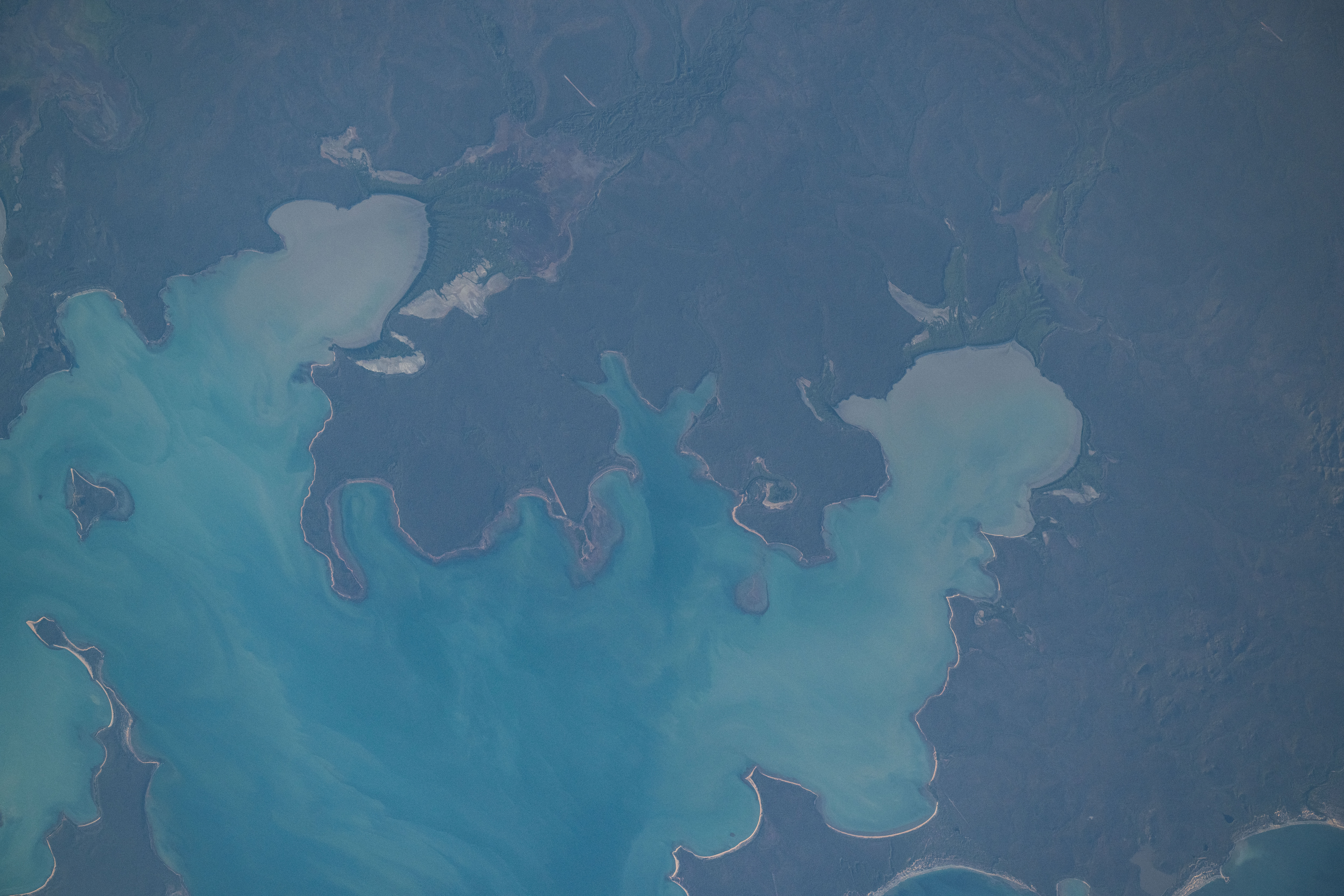 iss071e615395 (Sept. 9, 2024) -- As the International Space Station orbited 260 miles above the Northern Territory of Australia, NASA astronaut Mike Barratt captured this photograph of Blue Mud Bay.