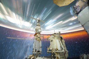 This long exposure photograph taken by NASA astronaut Matthew Dominick with a camera programmed for high sensitivity shows star trails and streaks of city lights as the International Space Station orbited 258 miles above the South China Sea off the coast of Vietnam near Ho Chi Minh City.