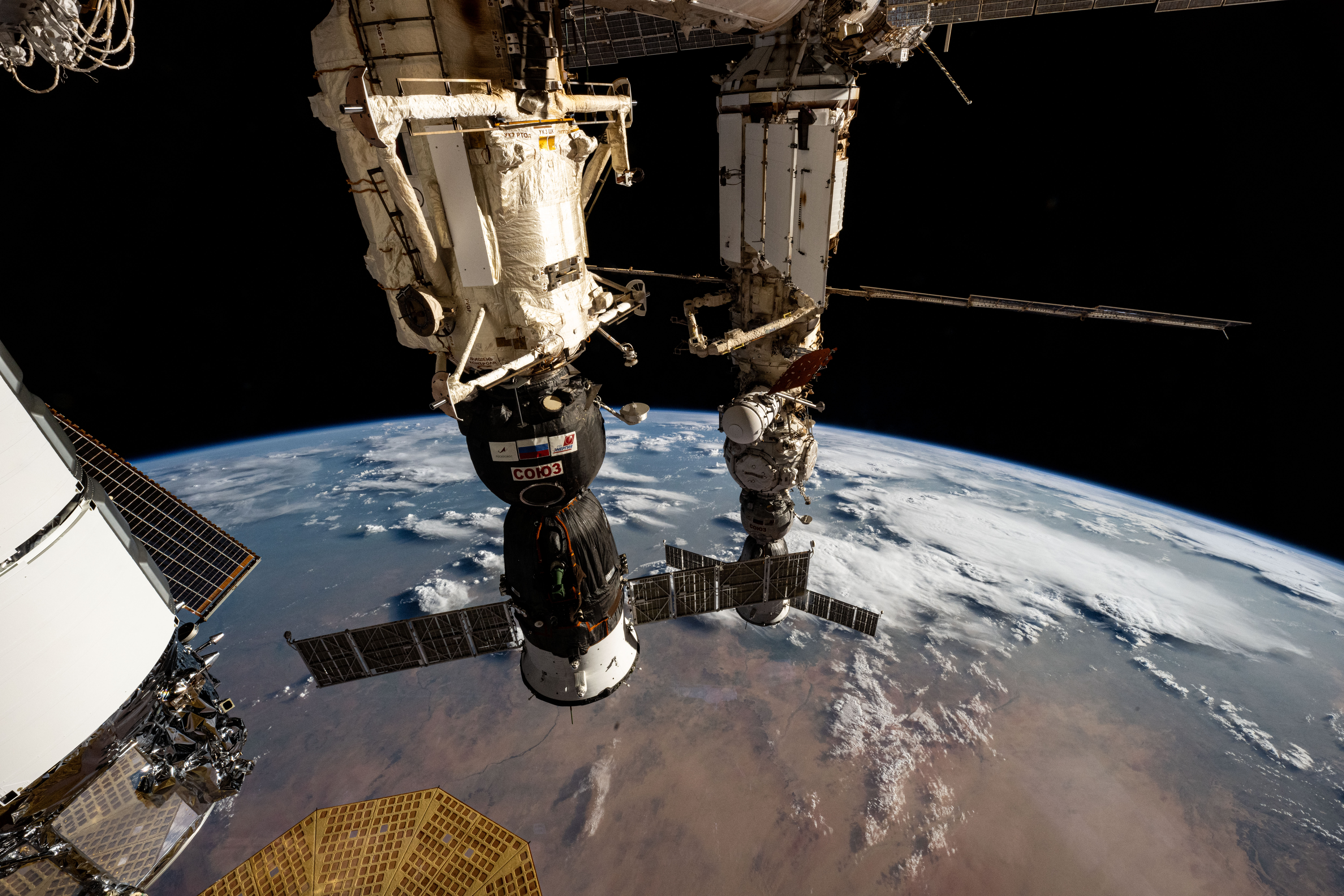 Two Roscosmos crew ships, the Soyuz MS-26 docked to the Rassvet module (foreground) and the Soyuz MS-25 (background) docked to the Prichal docking module, are pictured parked at the International Space Station as it orbited 258 miles above Sudan near the Nile River on the African continent.