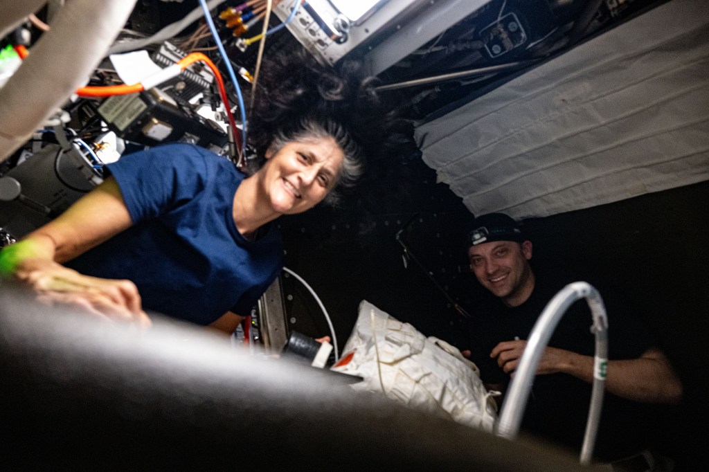Expedition 71 Flight Engineers Suni Williams and Matthew Dominick, both from NASA, servicie an oxygen generator preparing it for upcoming parts replacement aboard the International Space Station's Destiny laboratory module.
