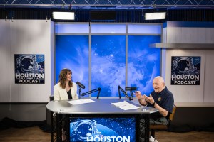 Houston We Have a Podcast Host Leah Cheshier and Gene Kranz sit down during the recording of Houston We Have a Podcast. Credit: NASA/Josh Valcarcel