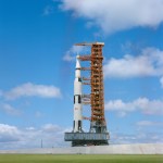 The Apollo 12 Saturn V rolling up the incline as it approaches Launch Pad 39A