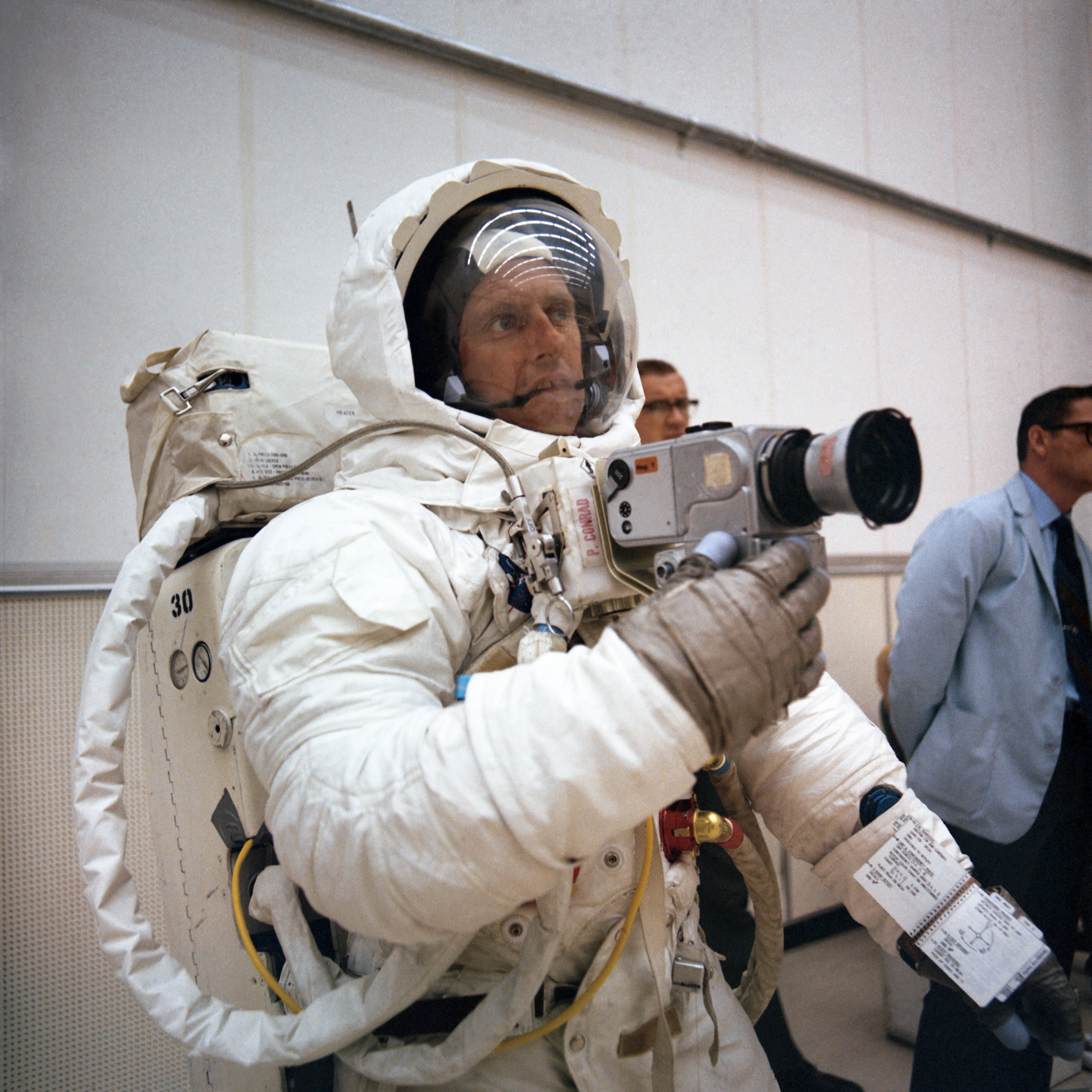 Conrad trains in the use of the Hasselblad camera he and Bean will use on the Moon