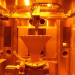 A 3D printer at RPM Innovations’ facility additively manufactures a funnel-shaped aerospike rocket engine nozzle