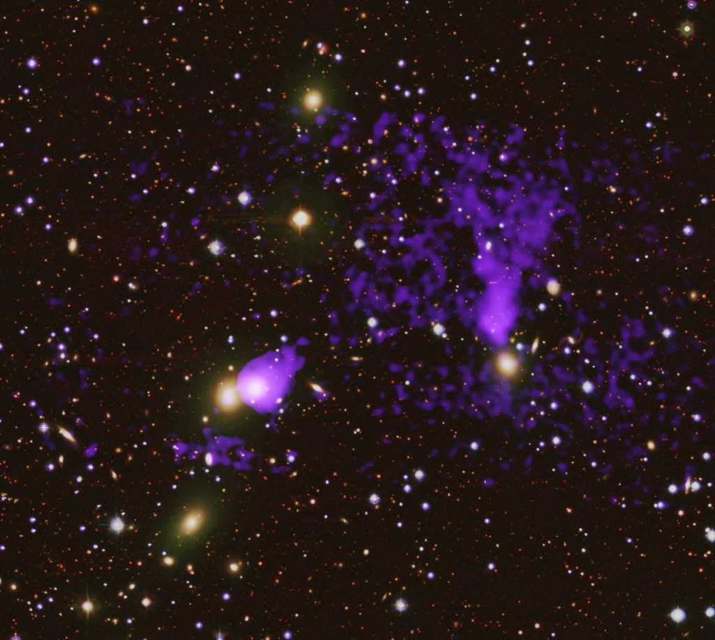 Researchers have discovered a second pair of tails trailing behind a galaxy in this cluster. Previously, astronomers discovered a shorter pair of tails from a different galaxy close to this latest one. This newer and longer set of tails was only seen because of a deeper observation with Chandra that revealed the fainter X-rays that have been shown in the optical data. These tails span for over a million light-years and help determine the evolution of the galaxy cluster.