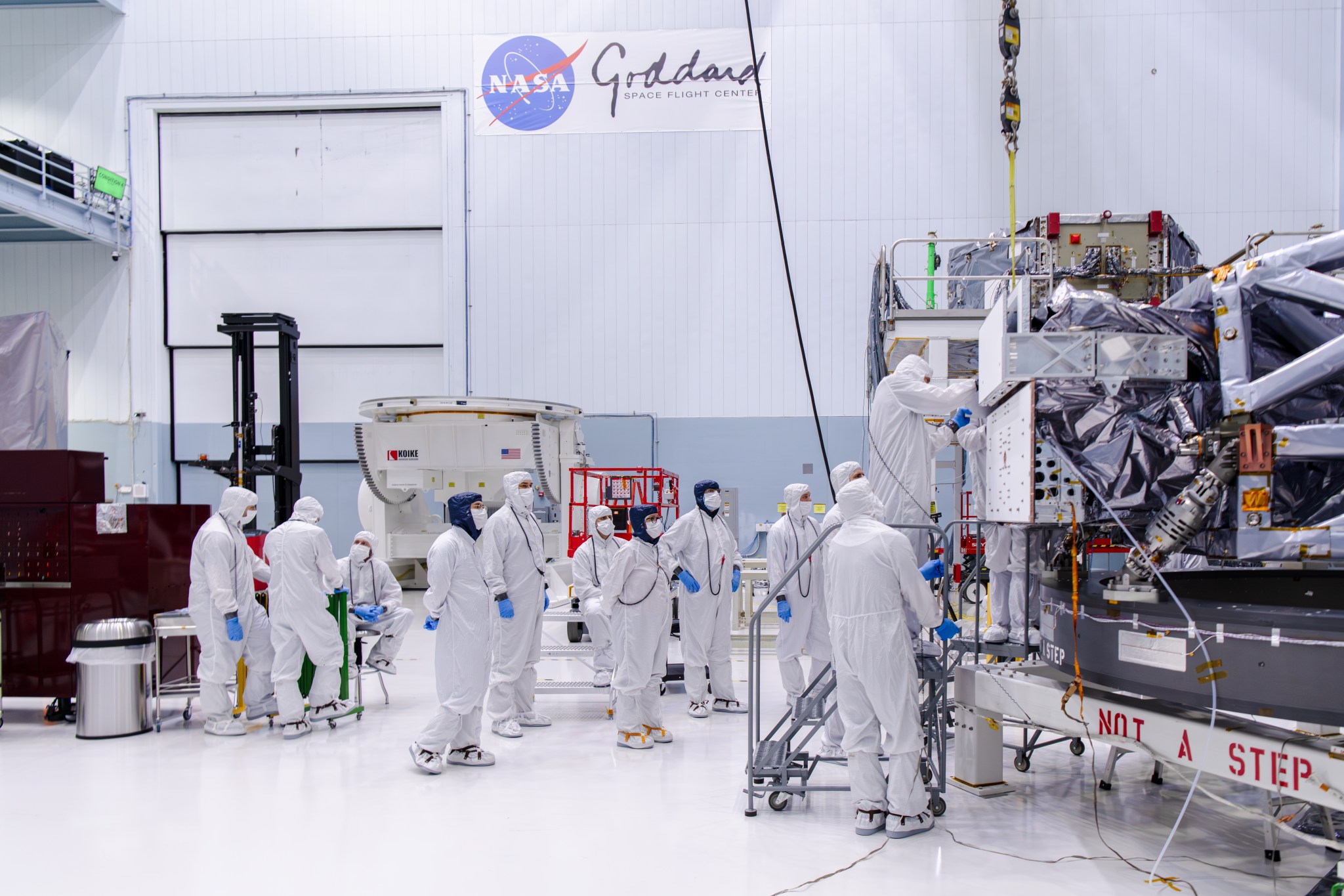 Clean room technicians install the Roman Coronagraph.