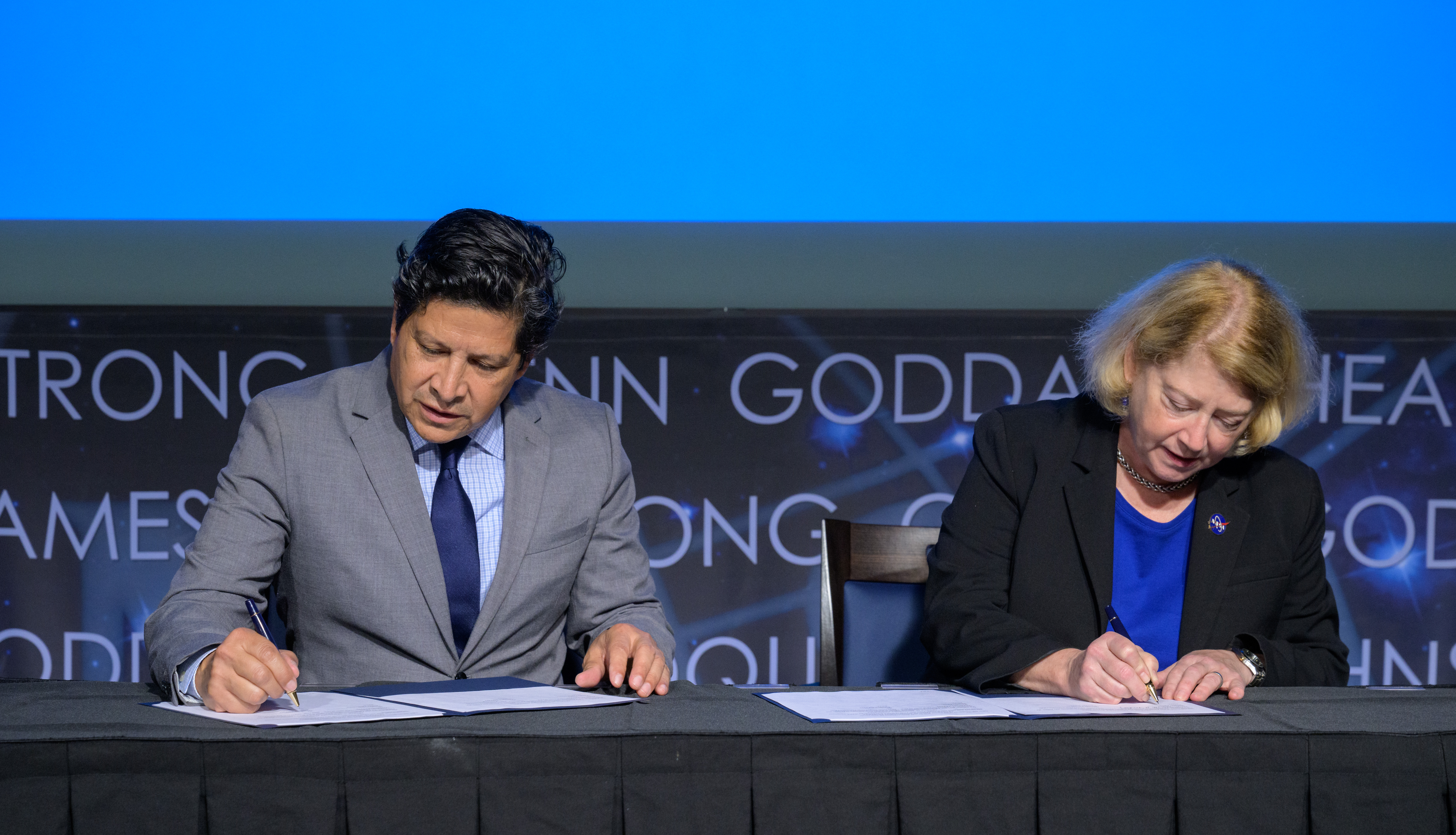 President and CEO of the Hispanic Heritage Foundation Jose Antonio Tijerino, left, and NASA Deputy Administrator Pam Melroy, sign a Space Act Agreement between the HHF and NASA to collaborate and expand STEM opportunities for Latino K-12 and university students and reduce barriers to agency activities and opportunities.