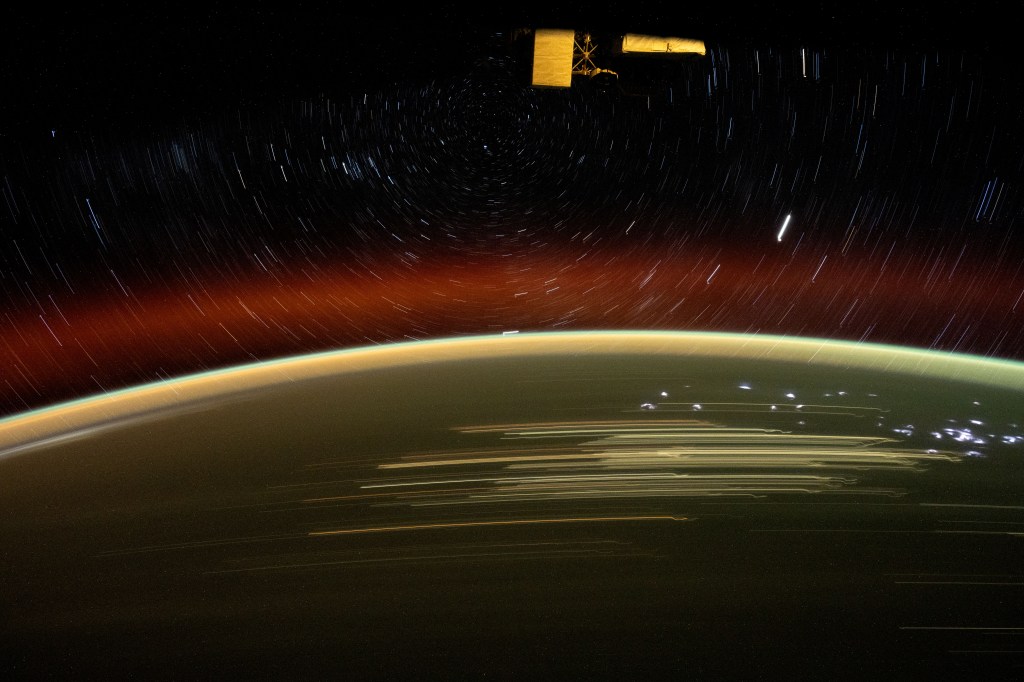 iss072e010734 (Oct. 1, 2024) -- As the International Space Station soared 266 miles over Western Australia, NASA astronaut Jeanette Epps captured this long-exposure shot of Earth at night and star trails glittering above the atmosphere.
