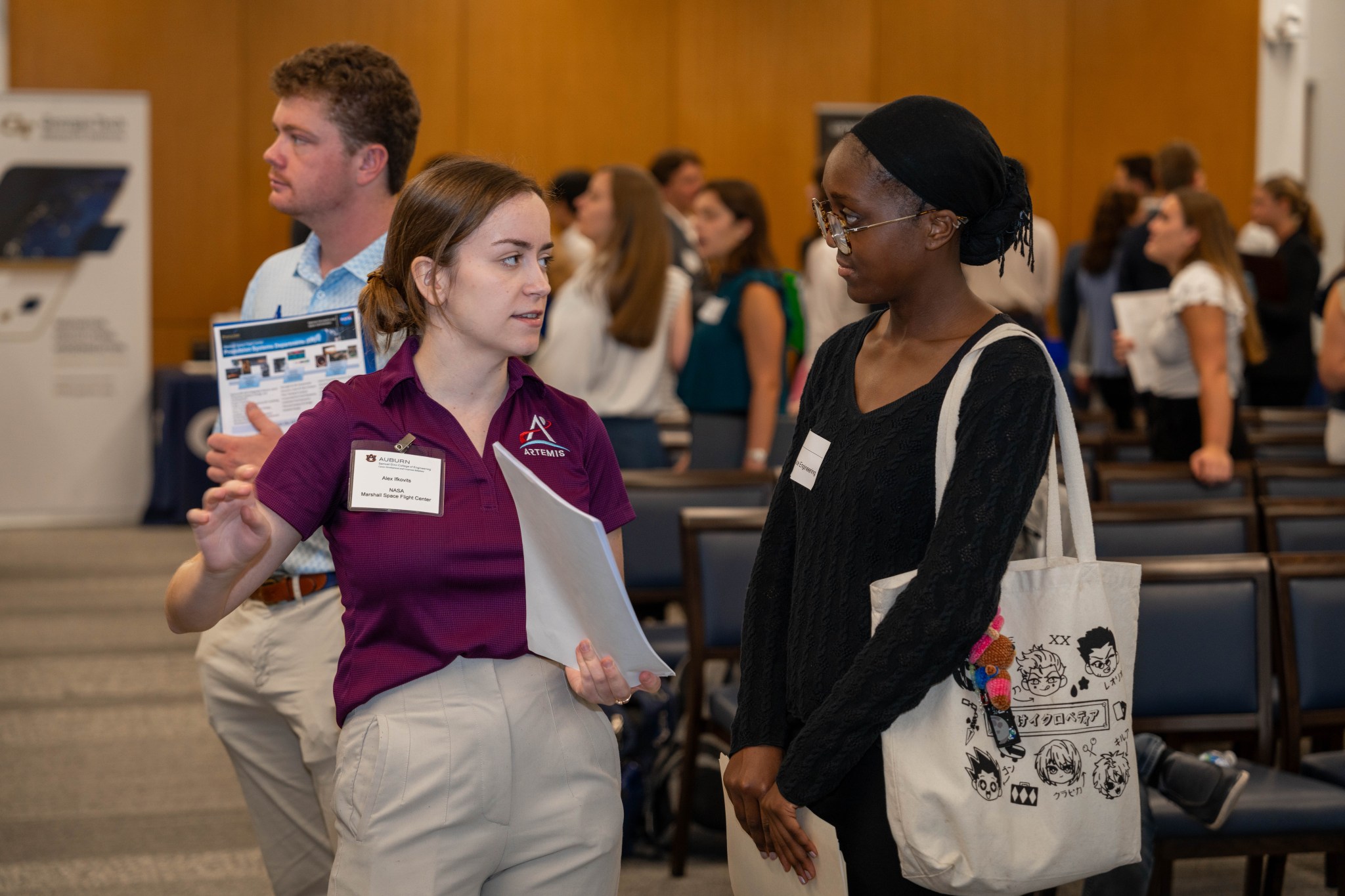 Alex Ifkovits, left, a Marshall liquid engine systems engineer, talks with an Auburn University student during Aerospace Industry Day events, which ran Sept. 30-Oct. 2. The event was the first of its kind at Auburn and is expected to become a perennial mainstay for the engineering curriculum.