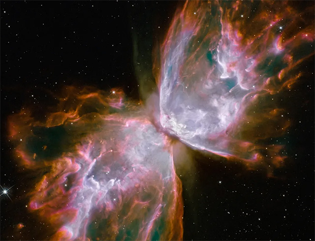 Cloud of gas resembling two large wings narrowed toward center against deep space