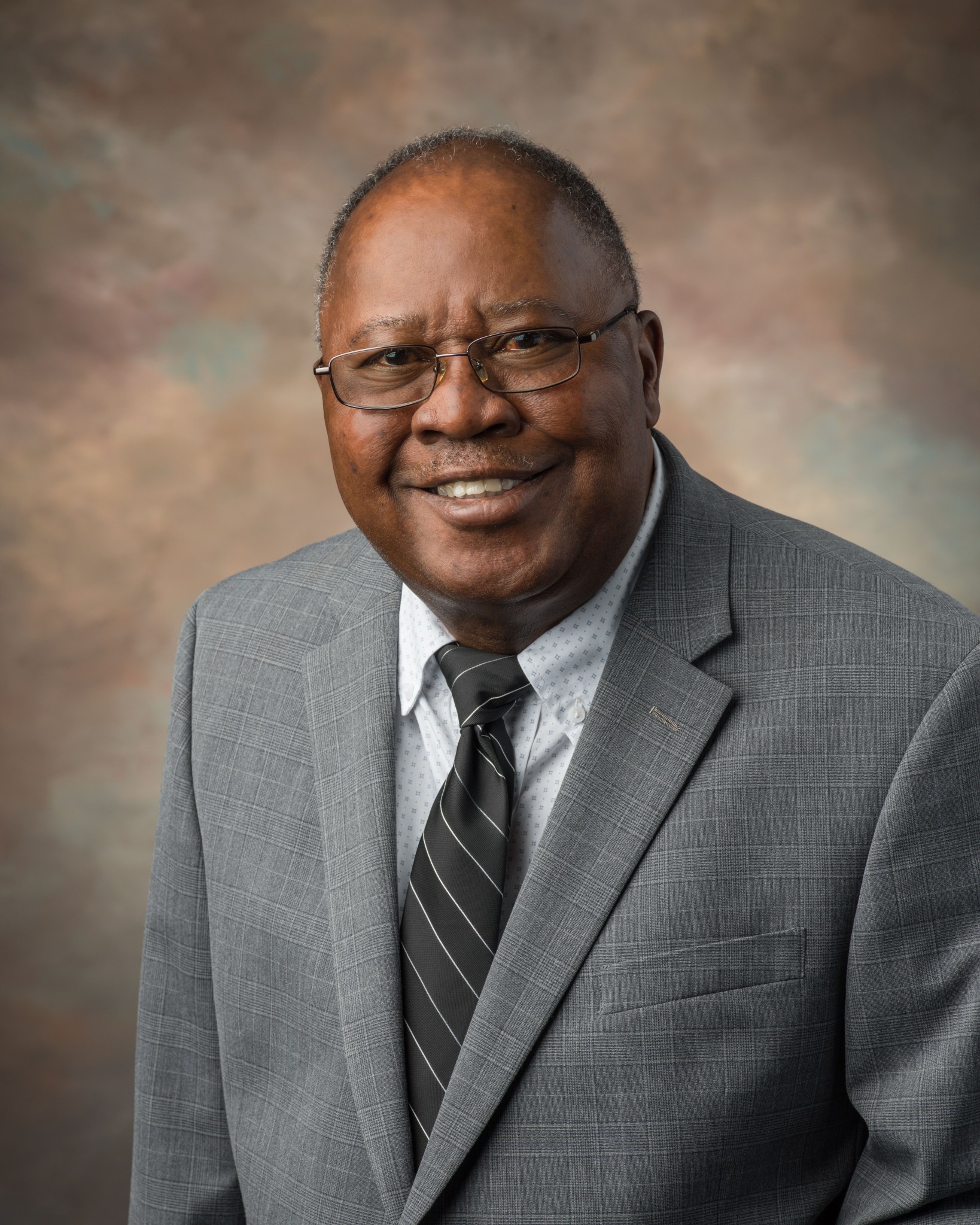 Official headshot of a male facility manager at Johnson Space Center.