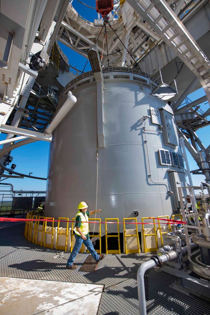 a team member work to secure an interstage simulator unit