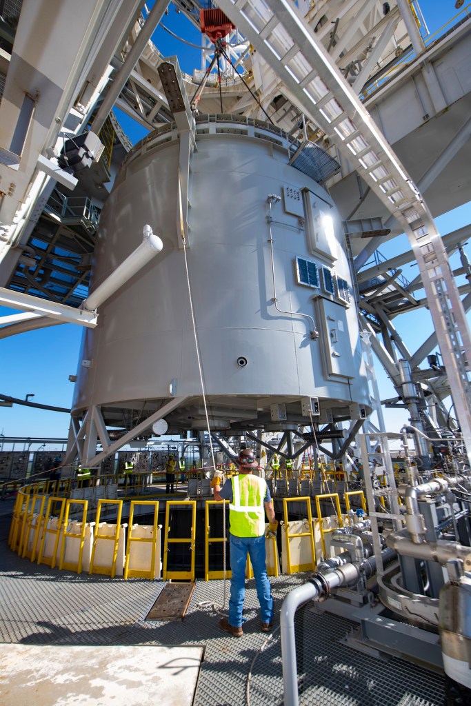 a team member work to secure an interstage simulator unit