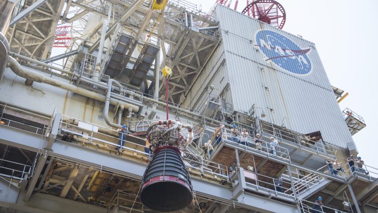 Crane lifting RS-25 developmental engine No. 0525 on the Fred Haise Test Stand (formerly the A-1 Test Stand) at NASA’s Stennis Space Center.