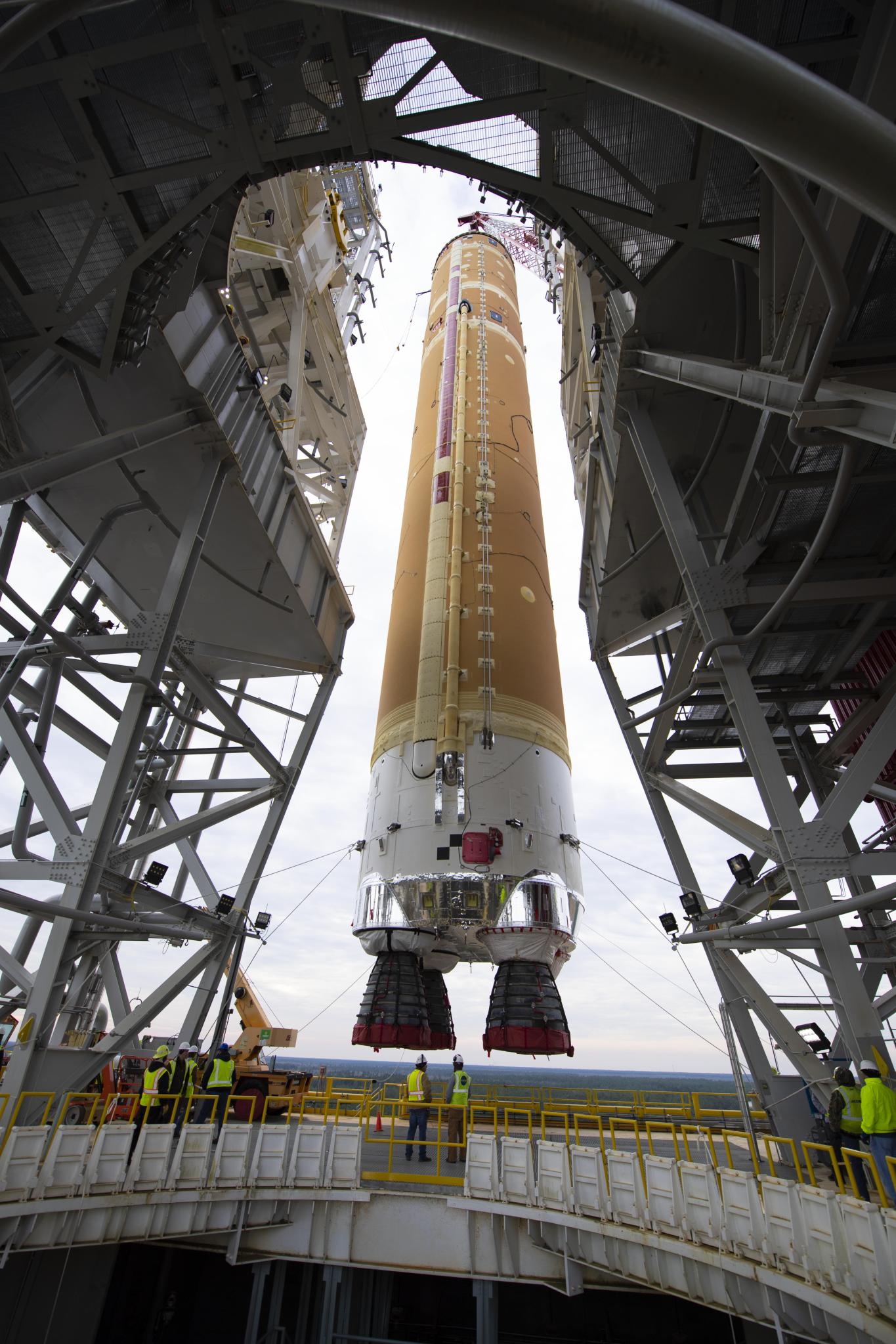 Stennis propulsion testing Crews  work , to install the first flight core stage of NASA’s SLS